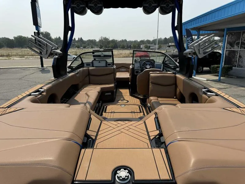 Slide: The Image of 2019 Supra SL450 boat interior with tan leather seating and modern dashboard. - 8