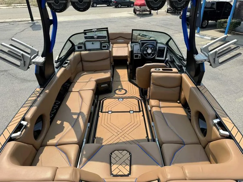 Slide: The Image of 2019 Supra SL450 boat interior with tan leather seating and modern dashboard. - 9