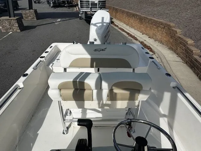 Slide: The Image of 2025 Bulls Bay 2400 boat interior with dual seats and steering wheel. - 10