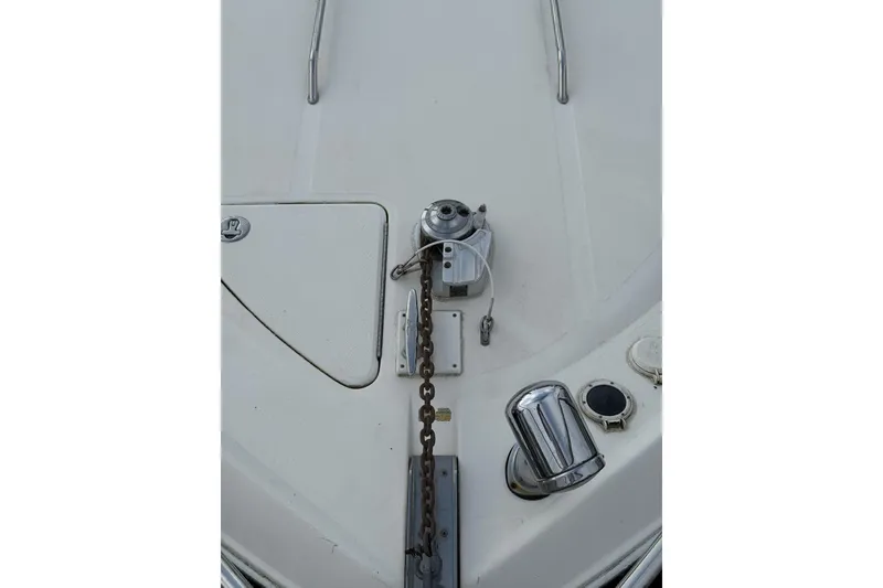 Slide: The Image of Bow of 2002 Sea Ray 310 Sundancer with anchor chain and winch. - 23