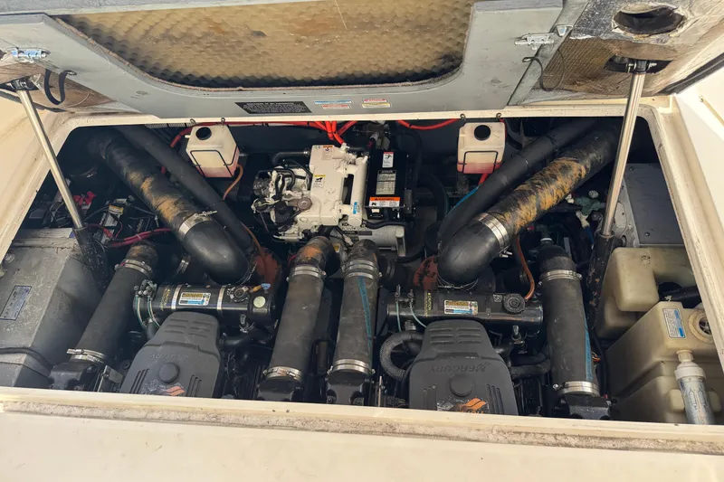 Slide: The Image of Engine compartment of a 2002 Sea Ray 310 Sundancer boat, showing mechanical components. - 25
