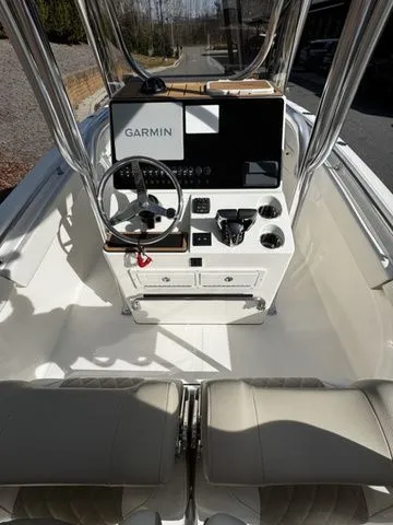 Slide: The Image of 2025 Bulls Bay 255CC boat cockpit with Garmin navigation system and dual seating. - 6