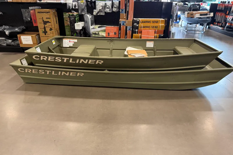 Slide: The Image of 2025 Crestliner 1436L CR Jon boats displayed in a store, showcasing durable design. - 5