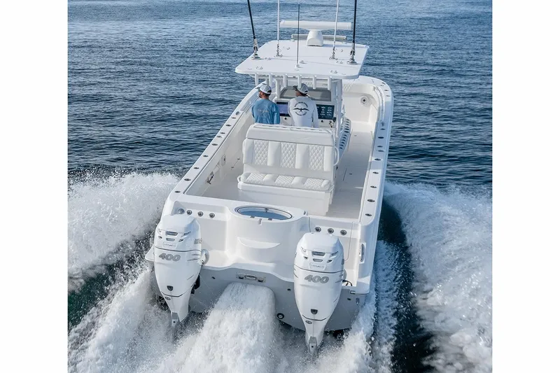 The Image of Manufacturer Provided Image: 2026 Invincible 33 Catamaran cruising on open water, rear view with dual engines. - 0