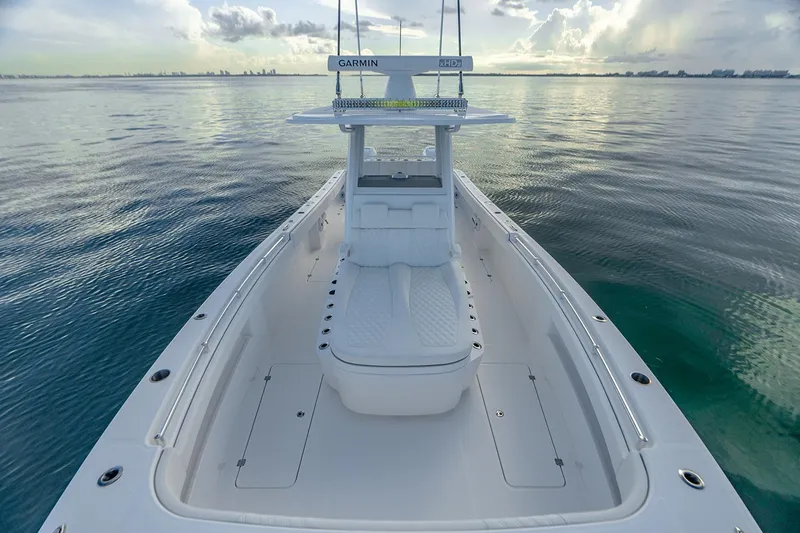 Slide: The Image of Manufacturer Provided Image: 2026 Invincible 33 Catamaran on calm water, showcasing sleek design and spacious deck. - 5