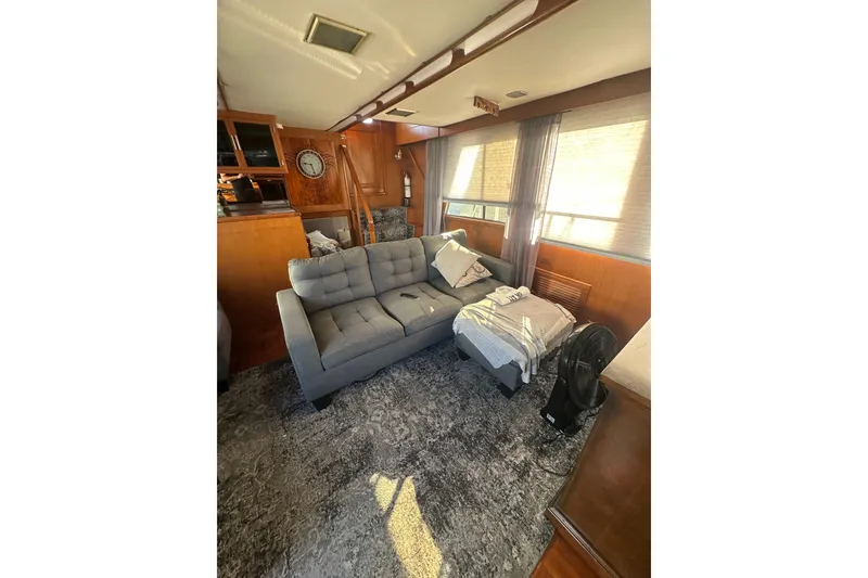 Slide: The Image of Interior of 1986 Lien Hwa 42 yacht with cozy seating and wooden accents. - 22