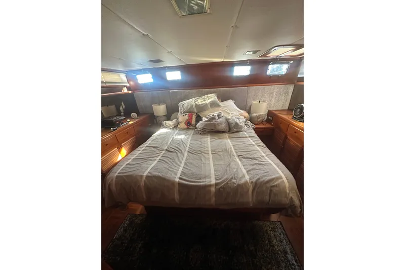 Slide: The Image of Cozy bedroom interior of 1986 Lien Hwa 42 yacht with wooden furnishings and natural light. - 26