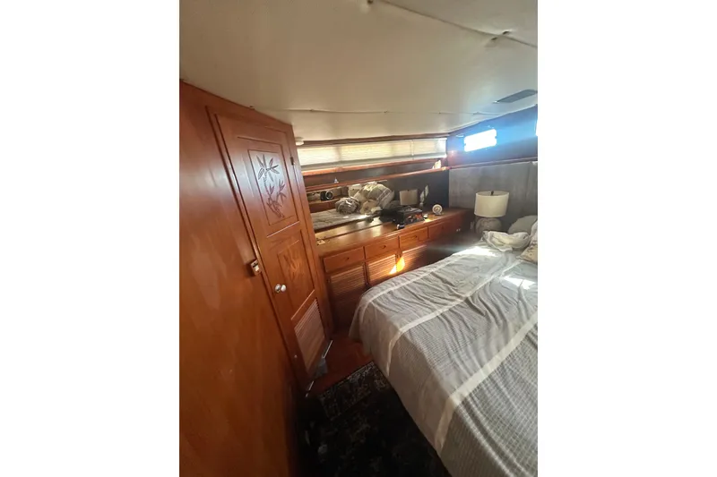 Slide: The Image of Cozy cabin interior of 1986 Lien Hwa 42 yacht with wooden furnishings. - 28