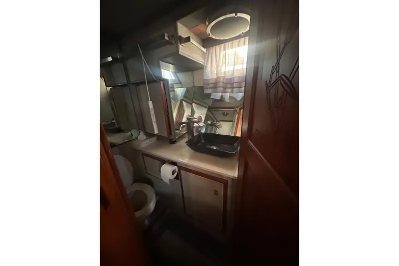 Slide: The Image of Bathroom interior of 1986 Lien Hwa 42 yacht with sink, toilet, and mirror. - 29