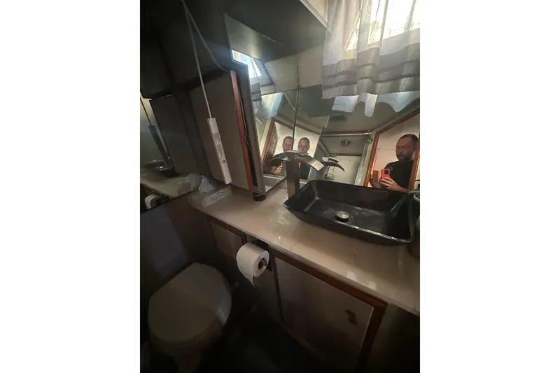Slide: The Image of Bathroom interior of 1986 Lien Hwa 42 yacht with modern sink and mirror. - 31