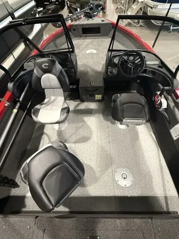 Slide: The Image of 2025 Crestliner 1750 Hawk boat interior with seating and steering console. - 4