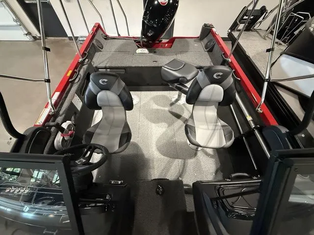Slide: The Image of 2025 Crestliner 1750 Hawk boat interior with dual seats and steering console. - 11