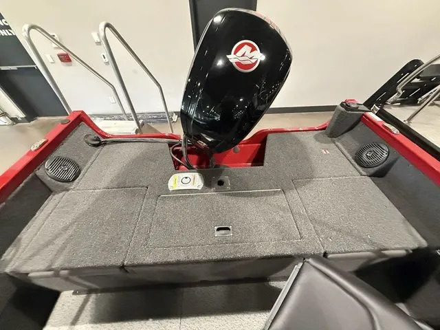 Slide: The Image of 2025 Crestliner 1750 Hawk boat interior with motor, red and gray design. - 12