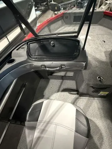 Slide: The Image of 2025 Crestliner 1750 Hawk interior with seating and storage compartments. - 7