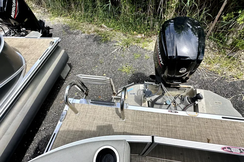 Slide: The Image of 2022 Cypress Cay Seabreeze 232 pontoon boat with Mercury outboard motor and swim ladder. - 11