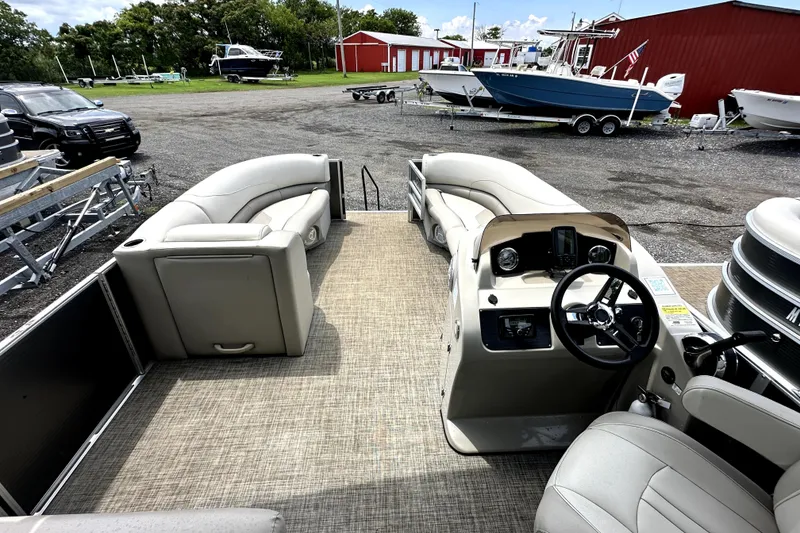 Slide: The Image of 2022 Cypress Cay Seabreeze 232 pontoon boat interior with helm and seating. - 5