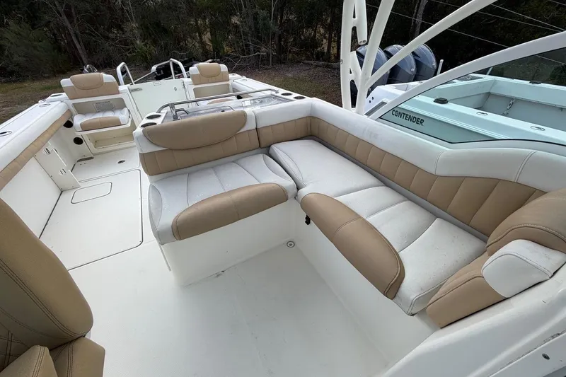 Slide: The Image of 2017 World Cat Glacier Bay Edition 2740 Dual Console boat interior with beige seating. - 10