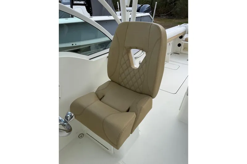 Slide: The Image of 2017 World Cat Glacier Bay Edition 2740 boat seat, beige upholstery, diamond stitching. - 12