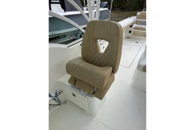 Slide: The Image of 2017 World Cat Glacier Bay Edition 2740 boat seat, beige upholstery, diamond stitching. - 13