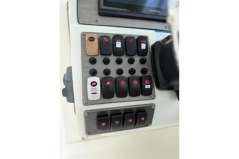 Slide: The Image of Control panel of 2017 World Cat Glacier Bay Edition 2740 Dual Console boat. - 17