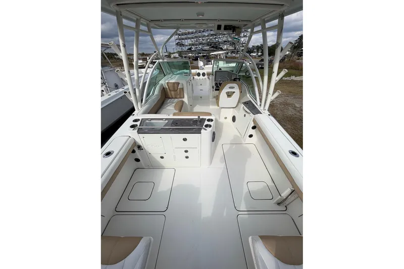 Slide: The Image of 2017 World Cat Glacier Bay Edition 2740 Dual Console boat interior, featuring seating and helm. - 26