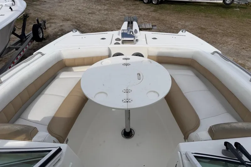 Slide: The Image of 2017 World Cat Glacier Bay Edition 2740 Dual Console boat interior with seating and table. - 34