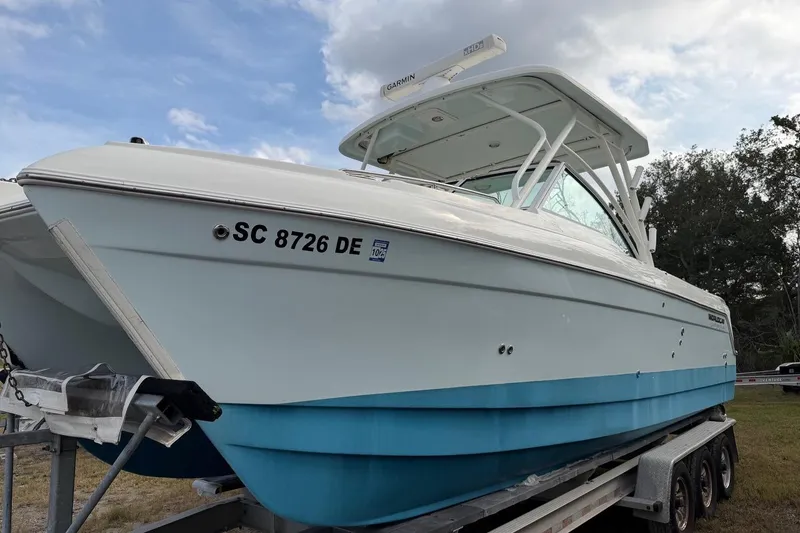 Slide: The Image of 2017 World Cat Glacier Bay Edition 2740 Dual Console boat on trailer. - 4