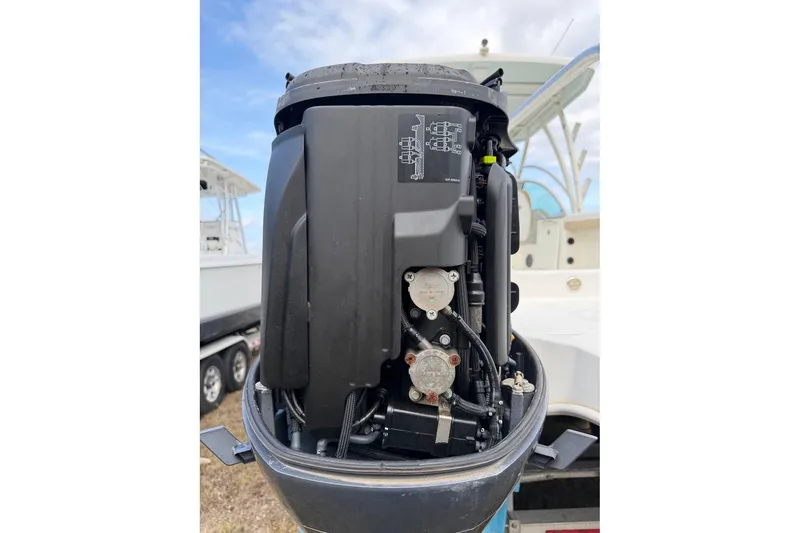 Slide: The Image of 2017 World Cat Glacier Bay Edition 2740 Dual Console boat engine close-up. - 59