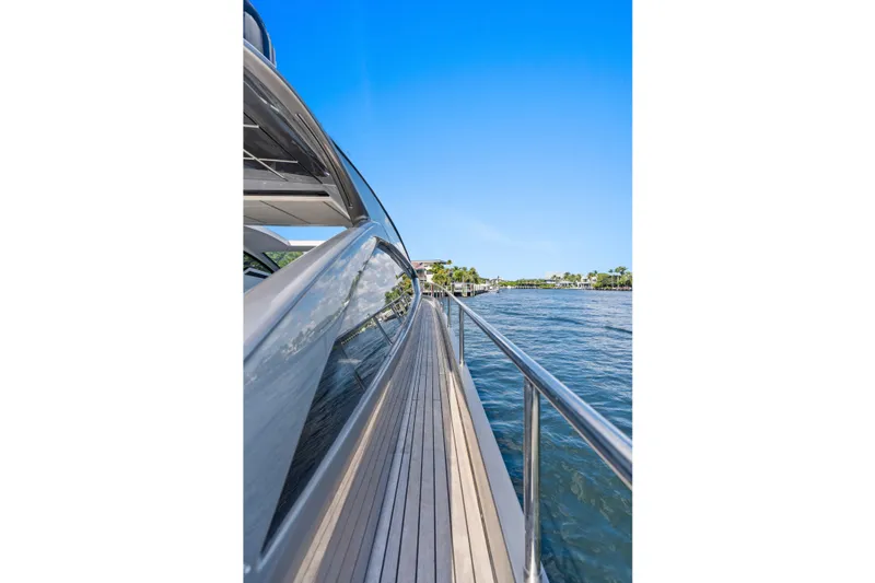 Slide: The Image of Side view of a 2016 Pershing 62' yacht on a sunny day. - 11