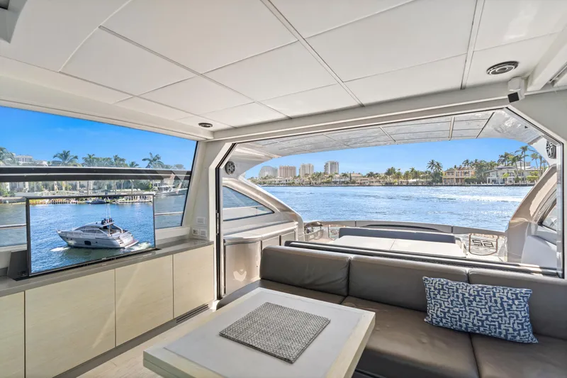 Slide: The Image of Luxurious 2016 Pershing 62' yacht interior with waterfront view and modern amenities. - 14