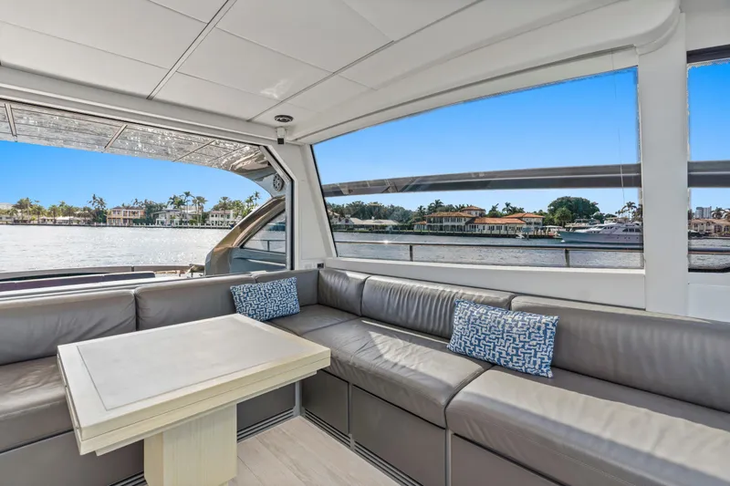 Slide: The Image of Luxurious interior of 2016 Pershing 62' yacht with waterfront view. - 15