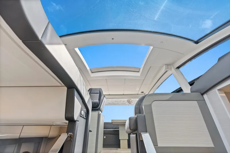 Slide: The Image of Interior view of 2016 Pershing 62' yacht with panoramic glass roof. - 18