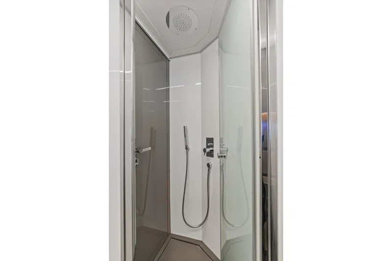 Slide: The Image of Modern shower cabin in a 2016 Pershing 62' yacht, featuring sleek design and fixtures. - 27