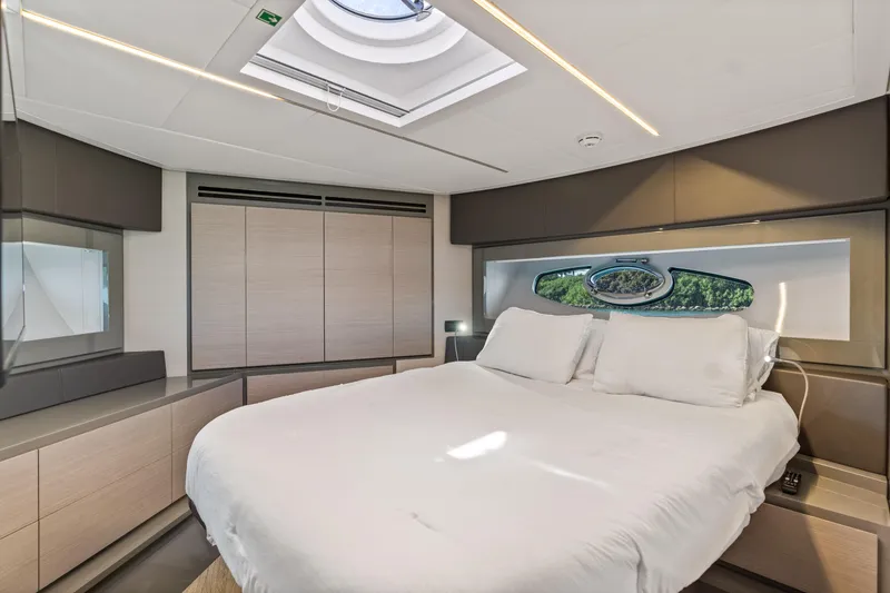 Slide: The Image of Luxurious bedroom interior of 2016 Pershing 62' yacht with skylight and modern design. - 28
