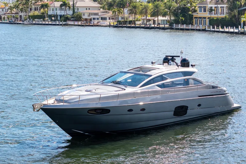 Slide: The Image of Luxury 2016 Pershing 62' yacht cruising on a sunny waterfront. - 3