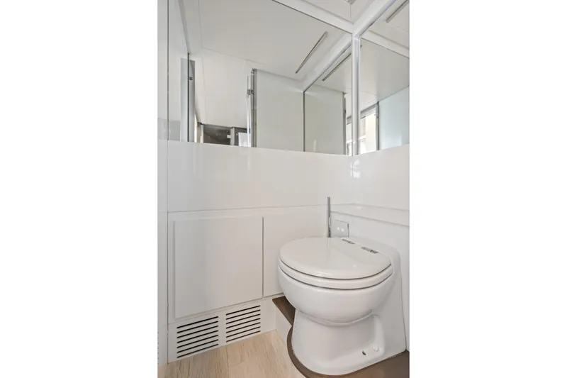 Slide: The Image of Modern bathroom on 2016 Pershing 62' yacht with sleek white design. - 37