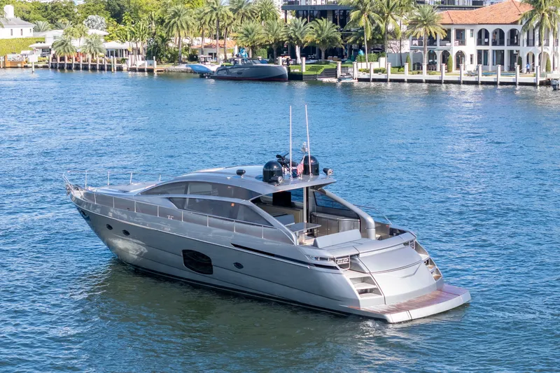 Slide: The Image of Luxury 2016 Pershing 62' yacht cruising on a scenic waterfront. - 5