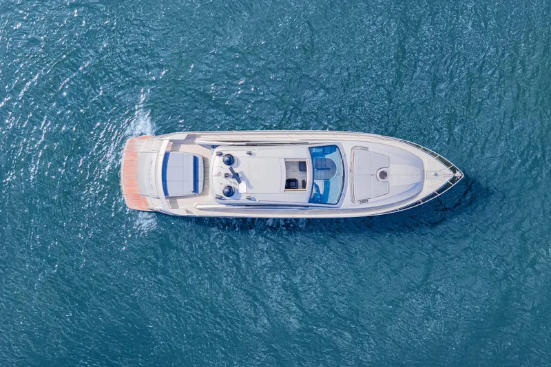 Slide: The Image of Aerial view of 2016 Pershing 62' yacht cruising on blue ocean waters. - 6
