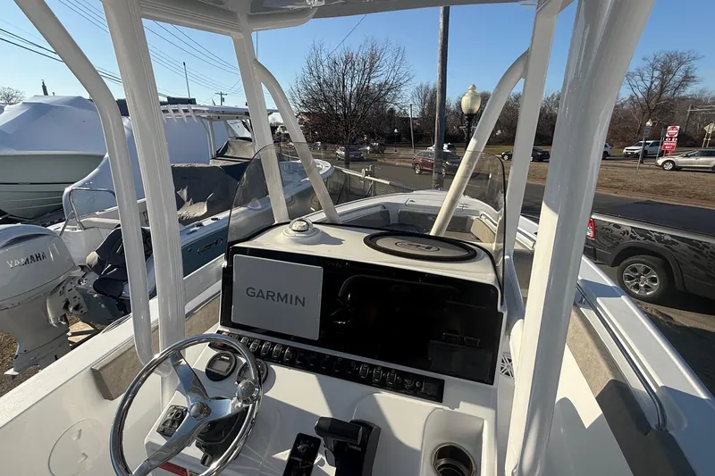 Slide: The Image of 2026 Sea Hunt Ultra 229 boat dashboard with Garmin navigation system. - 18