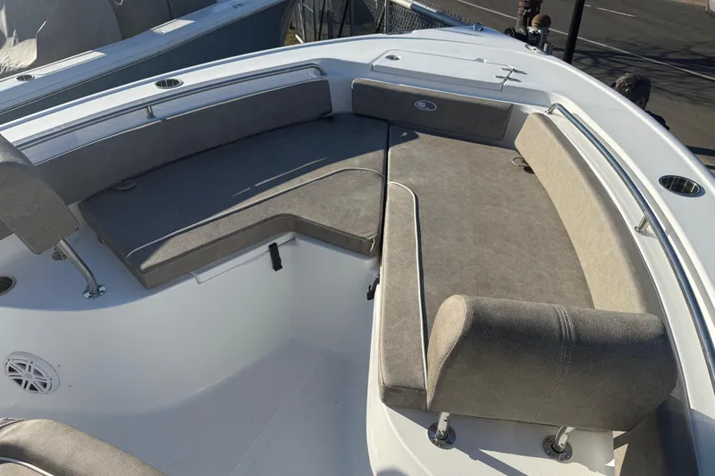 Slide: The Image of 2026 Sea Hunt Ultra 229 boat interior with cushioned seating and modern design. - 19