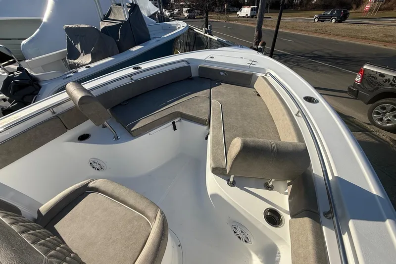 Slide: The Image of 2026 Sea Hunt Ultra 229 boat interior with cushioned seating and modern design. - 20