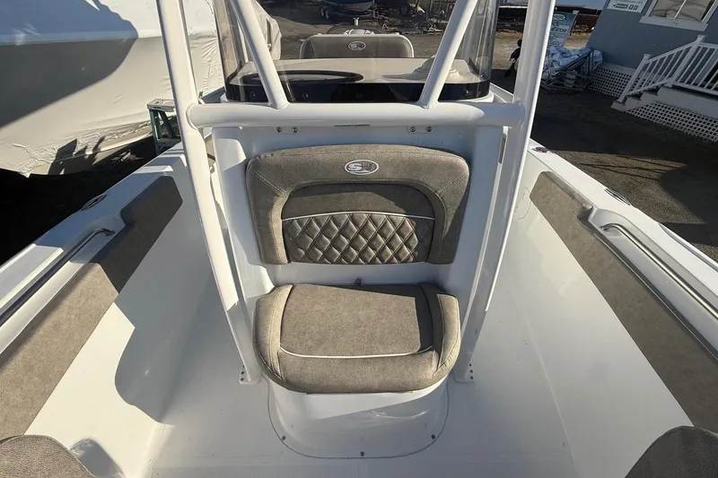 Slide: The Image of 2026 Sea Hunt Ultra 229 boat interior with cushioned seating and sleek design. - 21