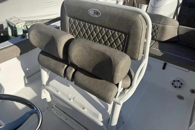 Slide: The Image of 2026 Sea Hunt Ultra 229 boat seat with gray upholstery and diamond stitching. - 25