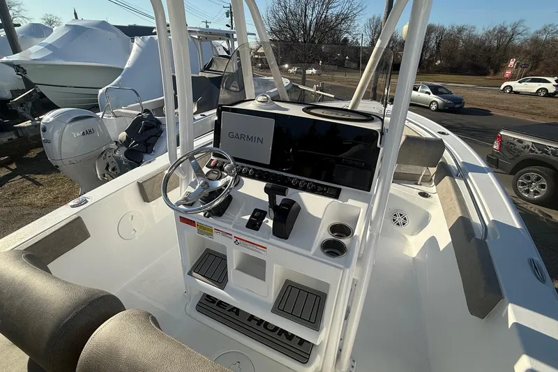 Slide: The Image of 2026 Sea Hunt Ultra 229 boat interior with Garmin navigation system and Yamaha engine. - 3