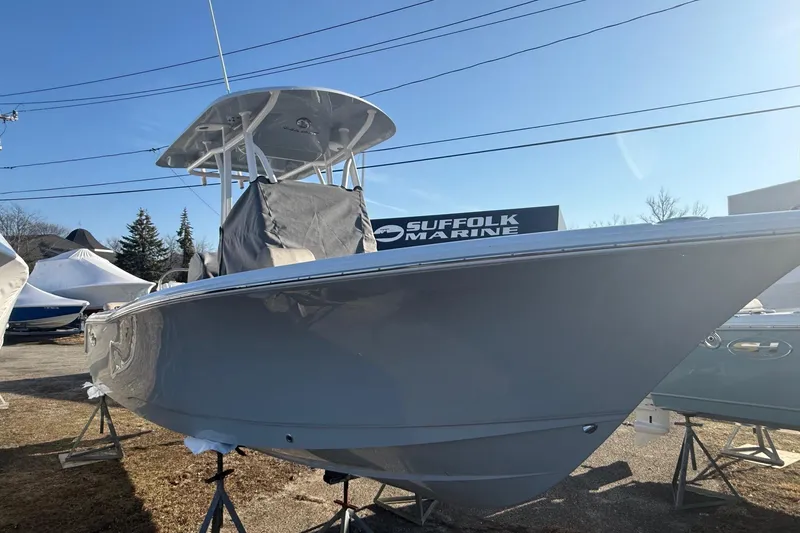 Slide: The Image of 2026 Sea Hunt Ultra 229 boat displayed at Suffolk Marine dealership. - 7