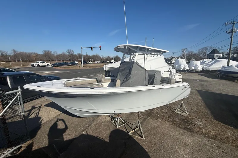 Slide: The Image of 2026 Sea Hunt Ultra 229 boat on display outdoors, clear sky background. - 9