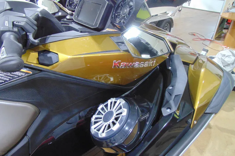Slide: The Image of 2023 Kawasaki Jetski Ultra 310LX in showroom, featuring sleek design and advanced controls. - 10