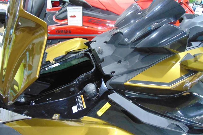 Slide: The Image of 2023 Kawasaki Jetski Ultra 310LX with open storage compartment, displayed indoors. - 13