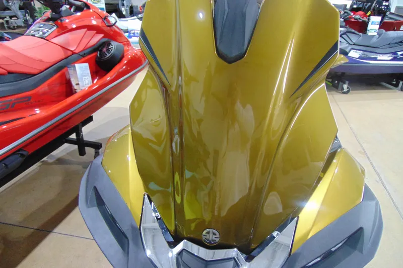 Slide: The Image of 2023 Kawasaki Jetski Ultra 310LX in showroom, gold color, front view. - 14