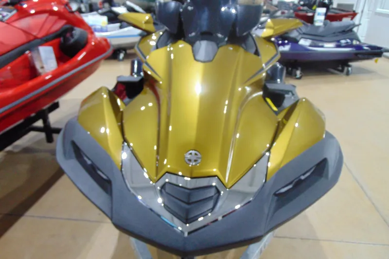Slide: The Image of 2023 Kawasaki Jetski Ultra 310LX in showroom, front view, gold color. - 3